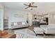 Open living room with kitchen view, hardwood floors, and comfortable seating at 1141 Logperch Way, Wendell, NC 27591
