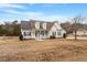 Two-story house with solar panels and a front porch at 118 Watersedge Ln, Smithfield, NC 27577