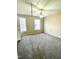 Carpeted bedroom featuring two windows offering natural light and a ceiling fan at 121 Gratiot Dr, Morrisville, NC 27560