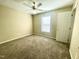 Bedroom featuring a window, ceiling fan and neutral colored walls, offering a blank canvas at 121 Gratiot Dr, Morrisville, NC 27560