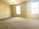 Bedroom with neutral walls, carpet, and natural light from windows, creating a serene and relaxing atmosphere at 121 Gratiot Dr, Morrisville, NC 27560