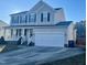 Two-story house with attached garage and front porch at 121 Gratiot Dr, Morrisville, NC 27560