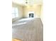 Cozy living room with plush carpeting and fireplace, creating a warm and inviting atmosphere for relaxation at 121 Gratiot Dr, Morrisville, NC 27560