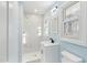 Clean bathroom, featuring a white vanity and marble shower at 1302 Buffaloe Rd, Garner, NC 27529