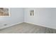 Neutral bedroom features luxury vinyl plank flooring, neutral walls and ample sunlight at 1302 Buffaloe Rd, Garner, NC 27529