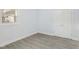 Bright bedroom with light gray walls and wood-look floors at 1302 Buffaloe Rd, Garner, NC 27529