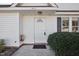 Front door entrance with brick walkway and landscaping at 1432 E Stonemason Dr, Fuquay Varina, NC 27526