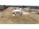Aerial view of a luxurious home on a large lot with a pond at 14425 Nc-96 N Hwy, Zebulon, NC 27597