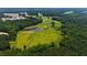 Expansive land parcel featuring a pond and surrounding trees, offering privacy and natural beauty at 14425 Nc-96 N Hwy, Zebulon, NC 27597