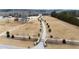 Aerial view of expansive property with a long driveway, multiple buildings, and lush fields at 14425 Nc-96 N Hwy, Zebulon, NC 27597