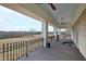 Spacious balcony with scenic views and ornate railing at 14425 Nc-96 N Hwy, Zebulon, NC 27597