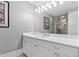 Bright bathroom with white vanity, large mirror, and a walk-in shower at 14425 Nc-96 N Hwy, Zebulon, NC 27597