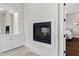 Bathroom with a fireplace, marble vanity and a view into the bedroom at 14425 Nc-96 N Hwy, Zebulon, NC 27597