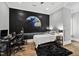 Bedroom featuring hardwood floors, a space-themed wall mural, a gaming setup and a comfortable bed at 14425 Nc-96 N Hwy, Zebulon, NC 27597