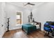 Bright bedroom with wood floors and a workspace at 14425 Nc-96 N Hwy, Zebulon, NC 27597