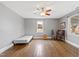 Bright bedroom with hardwood floors, window seat, and a view of the backyard at 14425 Nc-96 N Hwy, Zebulon, NC 27597