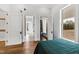 Bedroom with wood floors and access to bathroom and closet at 14425 Nc-96 N Hwy, Zebulon, NC 27597