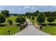Gated driveway leading to a stately home on a sprawling, well-manicured lawn at 14425 Nc-96 N Hwy, Zebulon, NC 27597