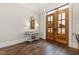 Light-filled entryway with console table and hardwood floors at 14425 Nc-96 N Hwy, Zebulon, NC 27597