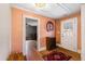 Inviting entryway with wood flooring, a bench, and access to other rooms at 14425 Nc-96 N Hwy, Zebulon, NC 27597
