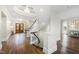Grand entryway with a curved staircase, hardwood floors, and a chandelier at 14425 Nc-96 N Hwy, Zebulon, NC 27597