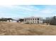 Two-story home with columns, balcony, and a large backyard at 14425 Nc-96 N Hwy, Zebulon, NC 27597