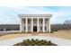 Two-story home with a stately facade, featuring columns and a brick exterior at 14425 Nc-96 N Hwy, Zebulon, NC 27597