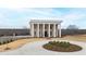 Two-story home with a stately facade, featuring columns and a brick exterior at 14425 Nc-96 N Hwy, Zebulon, NC 27597