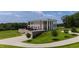 Stately brick home with large columns, a beautiful lawn, and mature trees at 14425 Nc-96 N Hwy, Zebulon, NC 27597