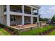 Inviting outdoor patio features seating, a barbecue grill, and elegant stonework, surrounded by greenery at 14425 Nc-96 N Hwy, Zebulon, NC 27597