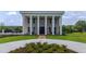 Grand exterior of home featuring beautiful landscaping and circle driveway at 14425 Nc-96 N Hwy, Zebulon, NC 27597