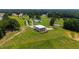 The luxury home is built on a knoll overlooking a private estate with tree lined drive and stocked pond at 14425 Nc-96 N Hwy, Zebulon, NC 27597