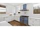 The kitchen has custom cabinets and a professional-grade blue range at 14425 Nc-96 N Hwy, Zebulon, NC 27597