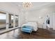 Spacious main bedroom with private balcony, walk-in closet, and hardwood floors at 14425 Nc-96 N Hwy, Zebulon, NC 27597