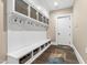 Functional mudroom with bench seating, cubbies, and coat hooks at 14425 Nc-96 N Hwy, Zebulon, NC 27597
