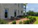 Outdoor patio featuring an outdoor seating set and garden with views of the lush green lawns and trees at 14425 Nc-96 N Hwy, Zebulon, NC 27597