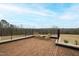 Brick patio with wrought iron fence and seating at 14425 Nc-96 N Hwy, Zebulon, NC 27597