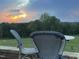 Sunset view from the patio, featuring two chairs and a table at 14425 Nc-96 N Hwy, Zebulon, NC 27597