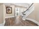 Elegant curved staircase with wooden railings and hardwood floors at 14425 Nc-96 N Hwy, Zebulon, NC 27597