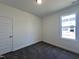 This cozy bedroom features neutral walls, plush carpeting, and a bright window for natural light at 150 W Saltgrass Ln, Smithfield, NC 27577