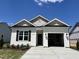 Charming single-Gathering home with a two-car garage, manicured lawn, and a classic design at 150 W Saltgrass Ln, Smithfield, NC 27577