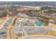 Aerial view of community clubhouse, pool, and tennis courts at 1509 Hornbeam Rd, Fuquay Varina, NC 27526