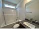 Bathroom showcasing tub, shower, vanity with granite countertop, and neutral-toned walls at 160 W Saltgrass Ln, Smithfield, NC 27577