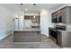 Modern kitchen featuring stainless steel appliances, a gray island, and stylish pendant lighting at 160 W Saltgrass Ln, Smithfield, NC 27577