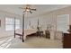 Charming bedroom with a four-poster bed and gold accent wall at 1604 Bass Lake Rd, Fuquay Varina, NC 27526