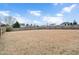 Large fenced backyard with ample space for outdoor activities at 1704 Little Drake Ave, Willow Springs, NC 27592