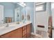 Bathroom with double vanity and a separate tub at 1704 Little Drake Ave, Willow Springs, NC 27592