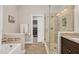 Spa-like bathroom with a walk-in shower and a soaking tub at 1704 Little Drake Ave, Willow Springs, NC 27592