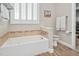 Bathroom with a large soaking tub and walk-in closet at 1704 Little Drake Ave, Willow Springs, NC 27592