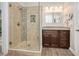 Bathroom with a large walk-in shower and granite vanity at 1704 Little Drake Ave, Willow Springs, NC 27592